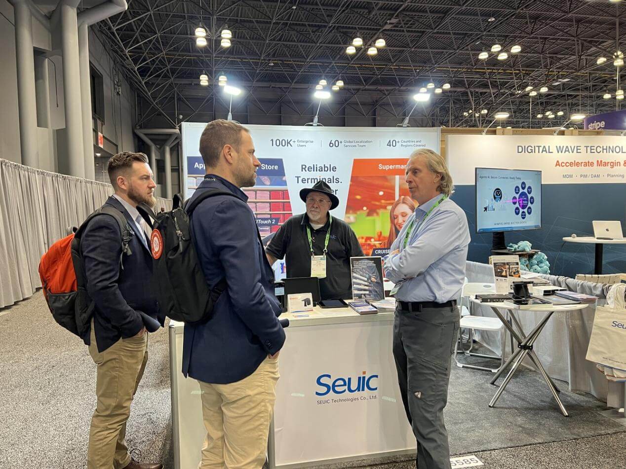 Attendees at the Seuic booth during an exhibition, discussing smart retail solutions under the theme "Reliable Terminals."